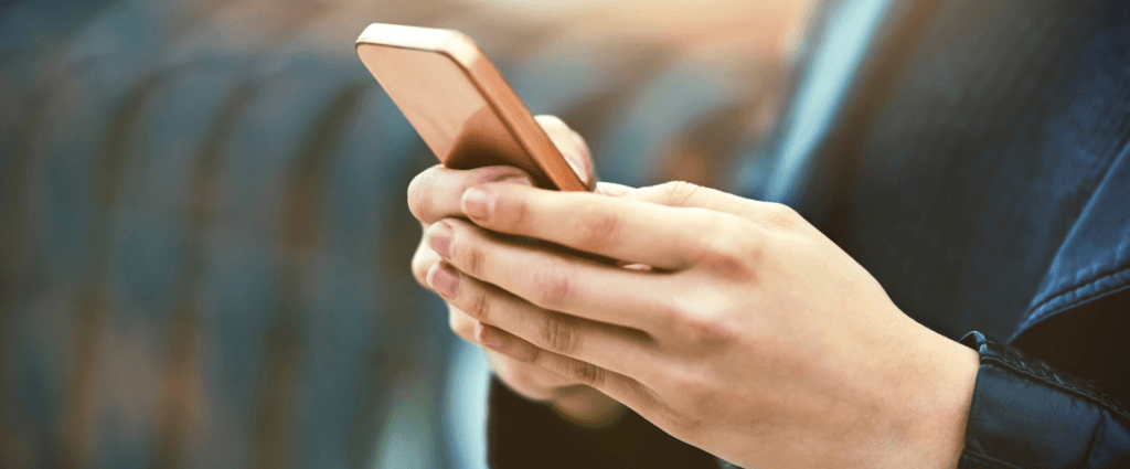 instant-communication-number-one-form-communication-cropped-shot-woman-using-mobile-phone-city 1-2